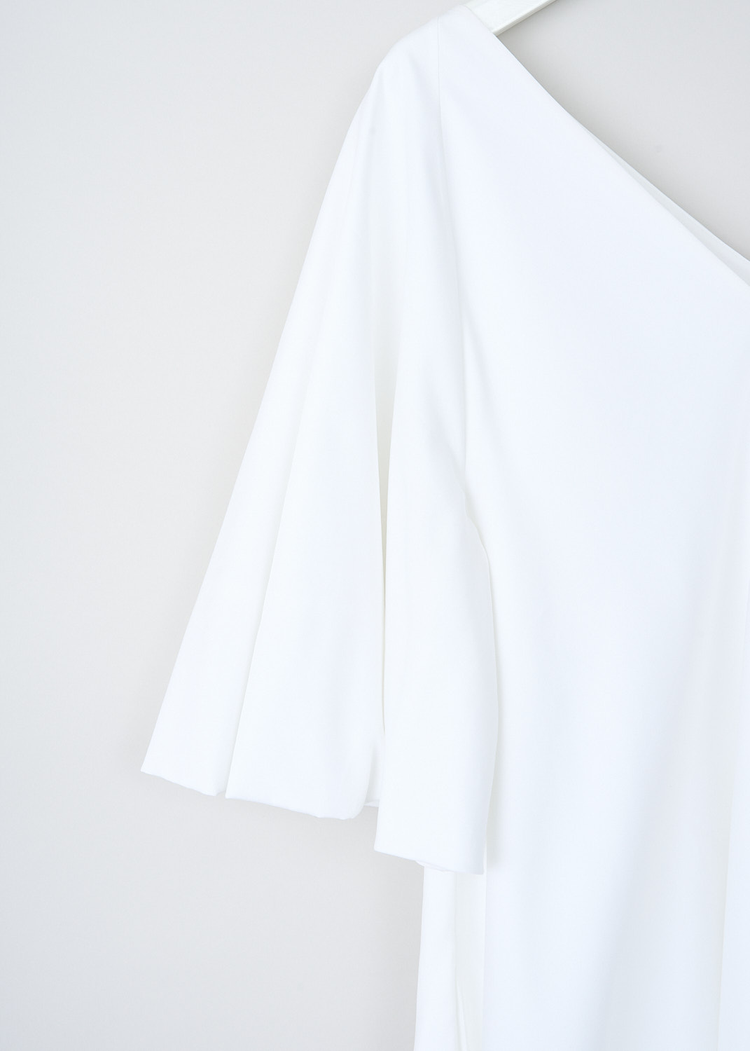 The Row, Lianne dress in Optic White, LIANNE_DRESS_3773N_W1017_OPTIC_WHITE, White, Detail, This Optic White Lianne midi dress has a V-neck and back. The dress has short bell sleeves and an A-line silhouette.  The hemline is straight.
