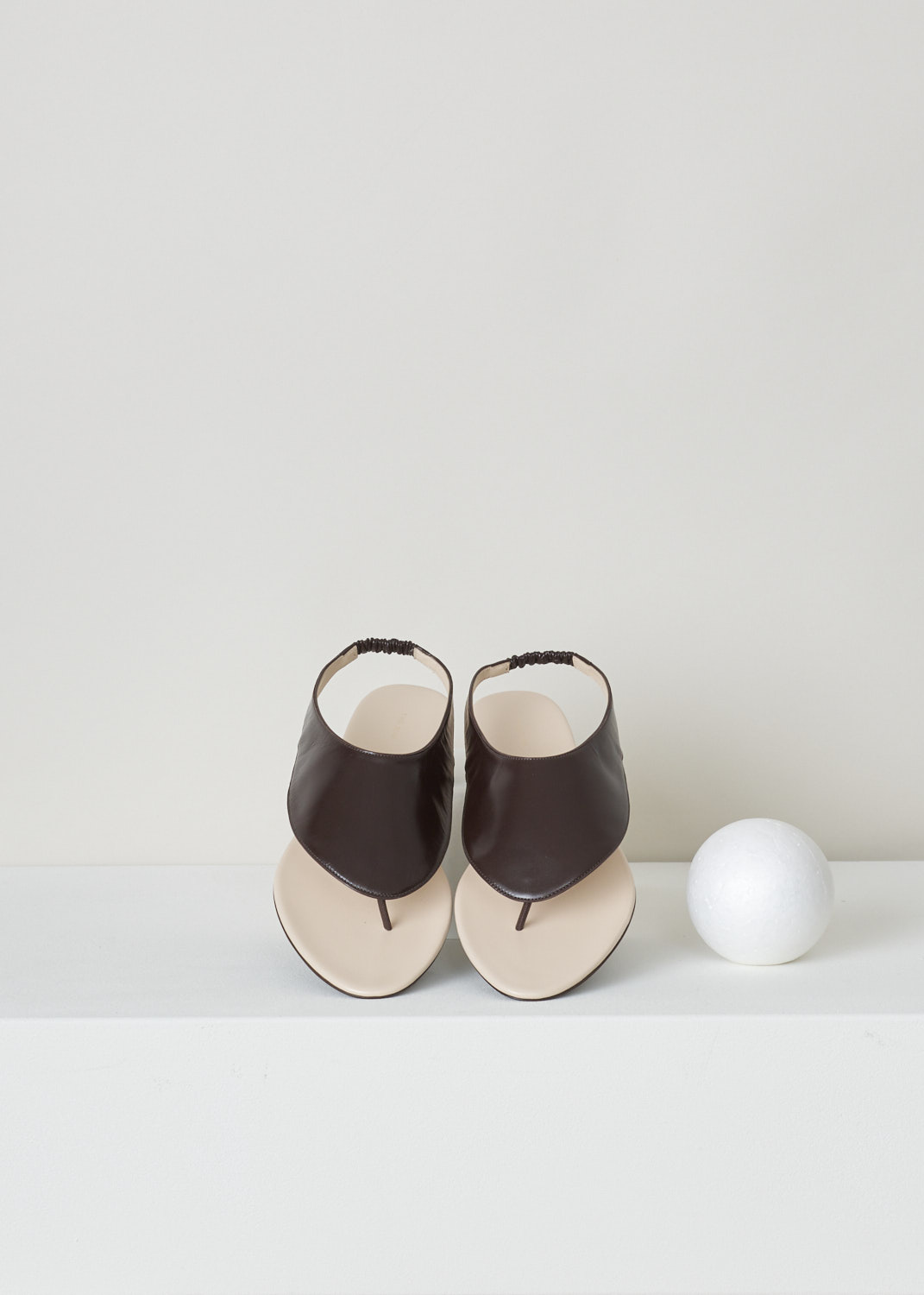 The Row, Dark brown ravello thong sandal, F1155_L35_DBR, brown, top, Ravelo slip-on sandals from The Row. Coloured to a lovely shade of dark brown. Featuring a round and open toe vamp and comes with an elastic slingback strap. 