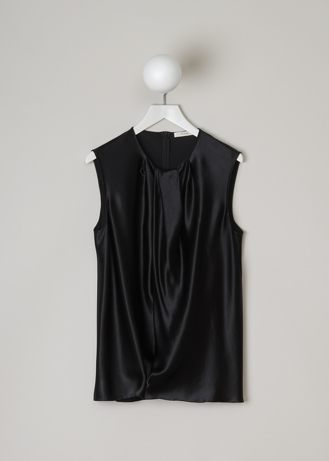 THE ROW, HAMMERED SATIN TOP IN BLACK, SHIRA_TOP_4923WI_616_BLACK,  Black, Front, This hammered satin sleeveless top in black has a round neckline with a pleated front detailing. In the back, a concealed centre zip can be found. The top has a wider silhouette.
