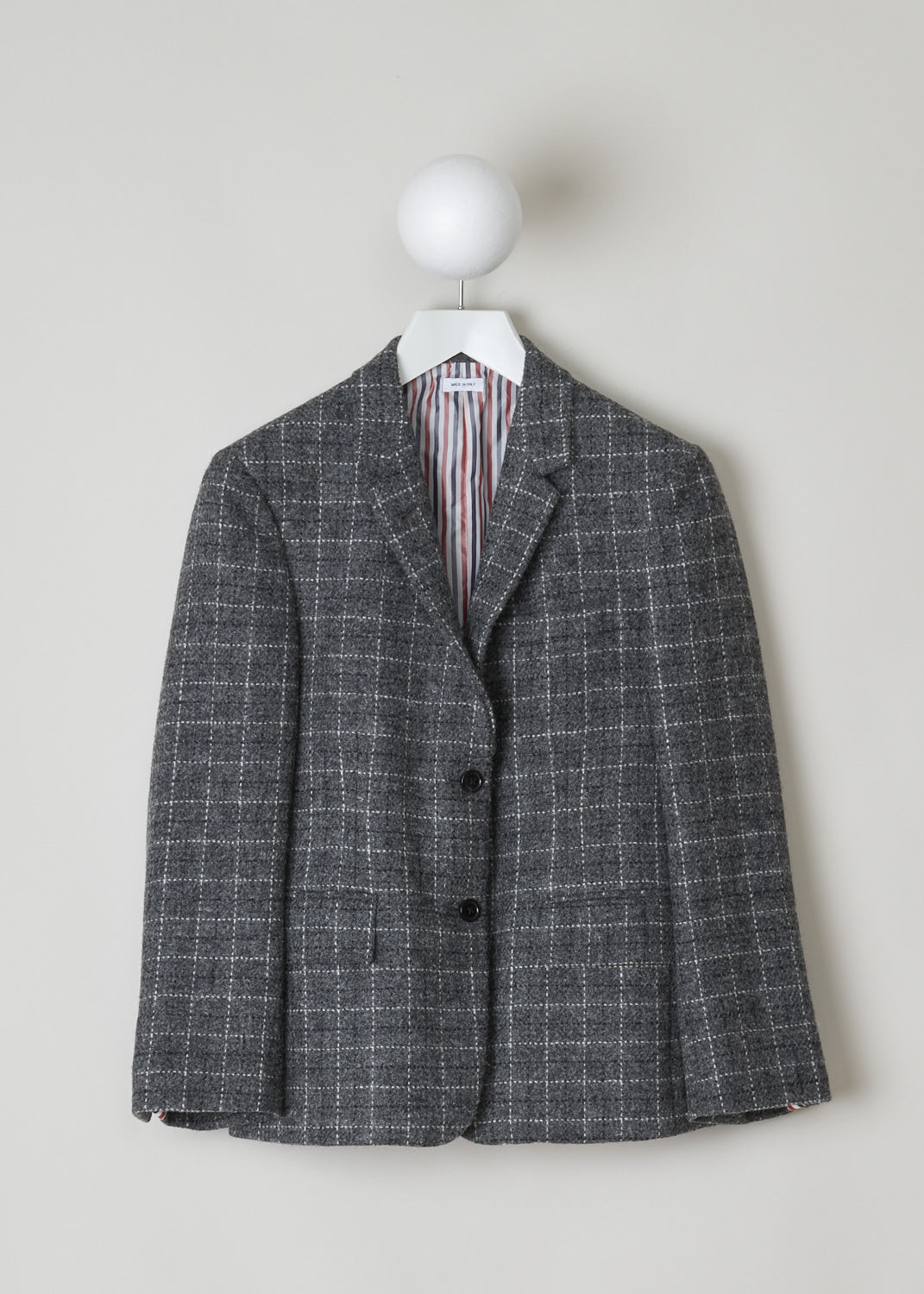THOM BROWNE, GREY TWEED BLAZER WITH CHECKED PATTERN, FBC637A_06878_025_DARK_GREY, Grey, Front, Grey tweed blazer with a checked pattern. This blazer features a notch lapel, a single chest pocket and two flap pockets and long cuffed sleeves with four buttons. Two buttons on the front are your fastening option on this blazer. This the back, the grosgrain tab can be found.
