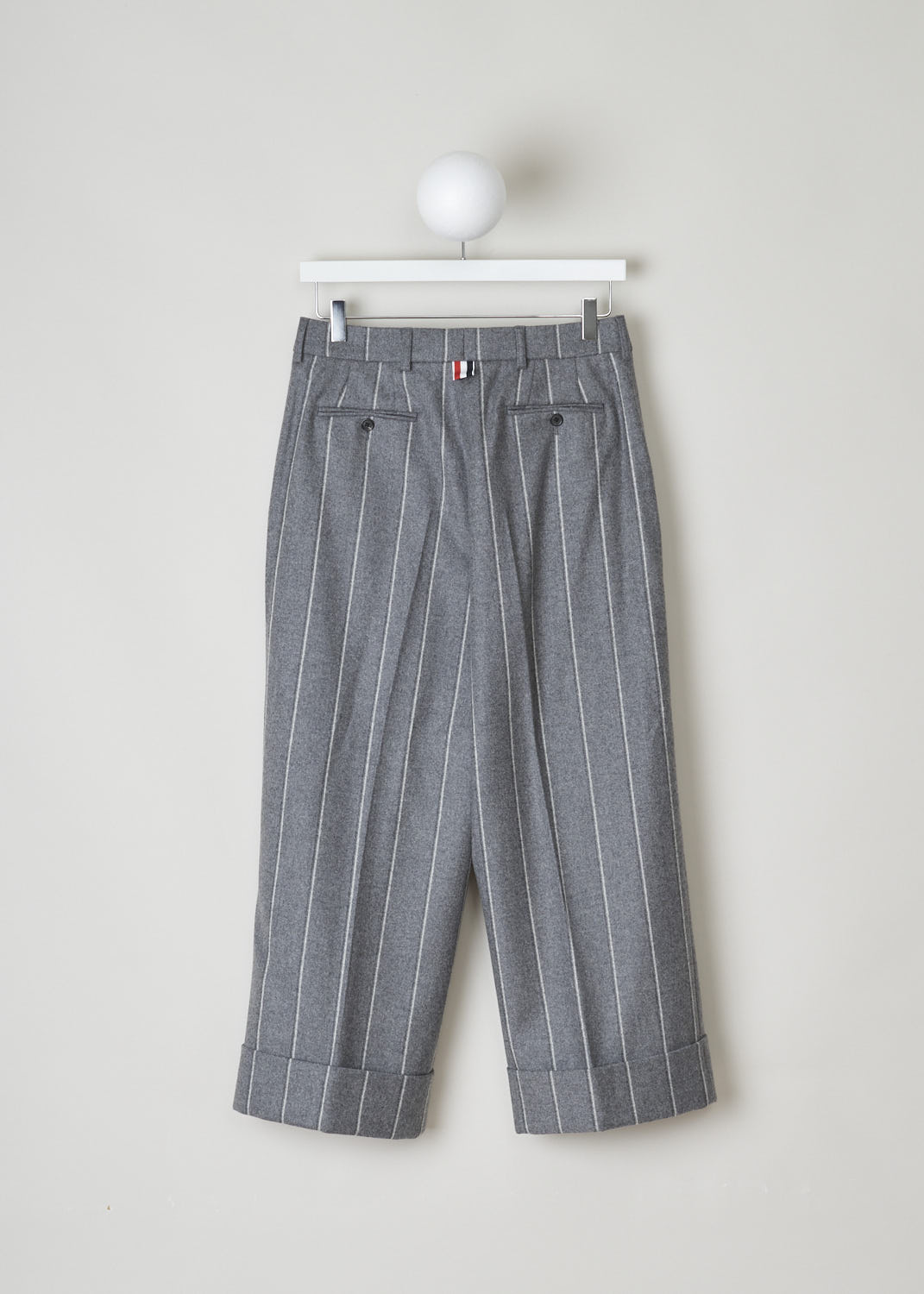 THOM BROWNE, WOOL FLANNEL STRIPED TROUSERS, FTC160A_05019_035_MED_GREY, Grey, Print, Back, These heather grey, striped trousers have belt loops and a clap a zip closure They feature slanted pockets in the front and buttoned welt pockets in the back. The pant legs end in broad, folded hem. 
