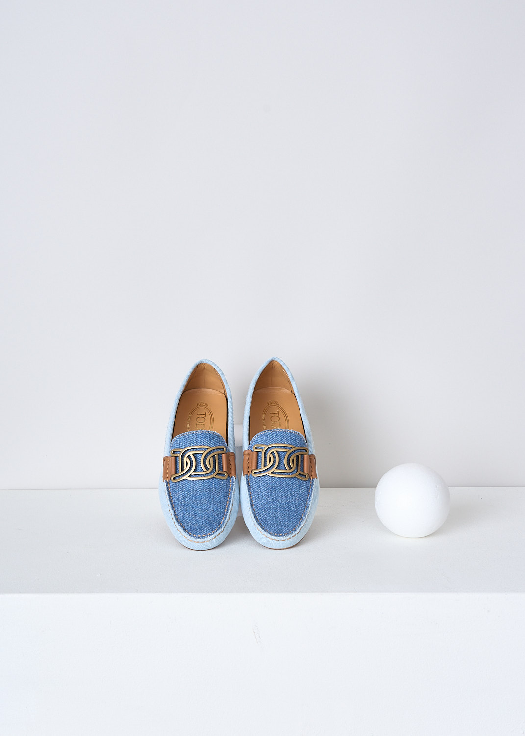 TODS, TWO-TONE DENIM LOAFERS, XXW00G0HB10R43ZZEU, Blue, Top, These two-tone slip-on loafers have a darker denim top and lighter denim sides. The brand's gold-tone logo chain is attached with brown leather straps. Noticeable are the rubber soles with studded profile that extends further to the rear trim. 
