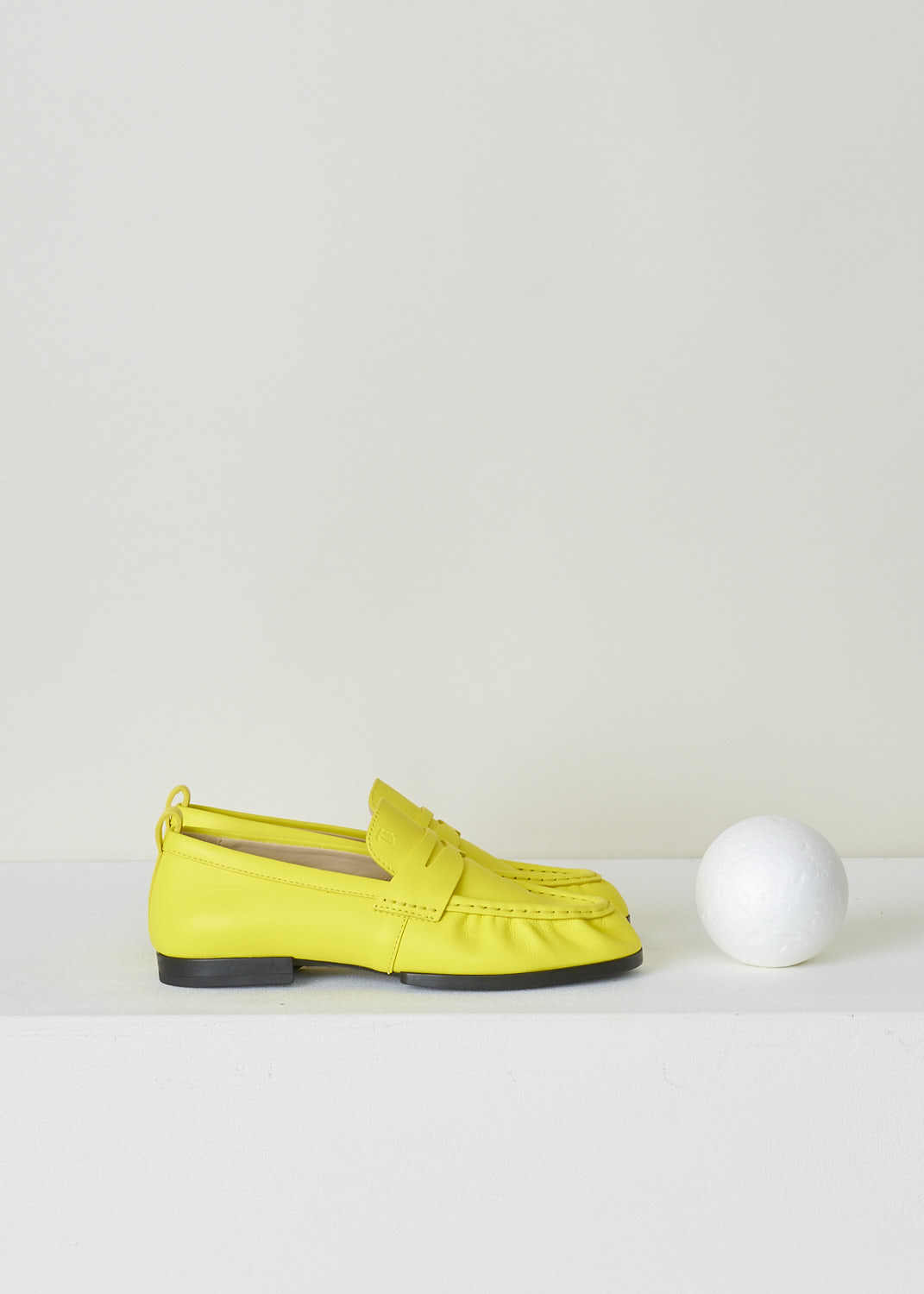 TODS, BRIGHT YELLOW PENNY LOAFERS, XXW02E0EC60PHXG009_PHX_HOLIDAY, Yellow, Side, These bright yellow slip-on penny loafers have a rounded toe and a decorative slotted leather strip over the upper side. Around the trim, the leather is subtly pleated. These loafers have black soles.

