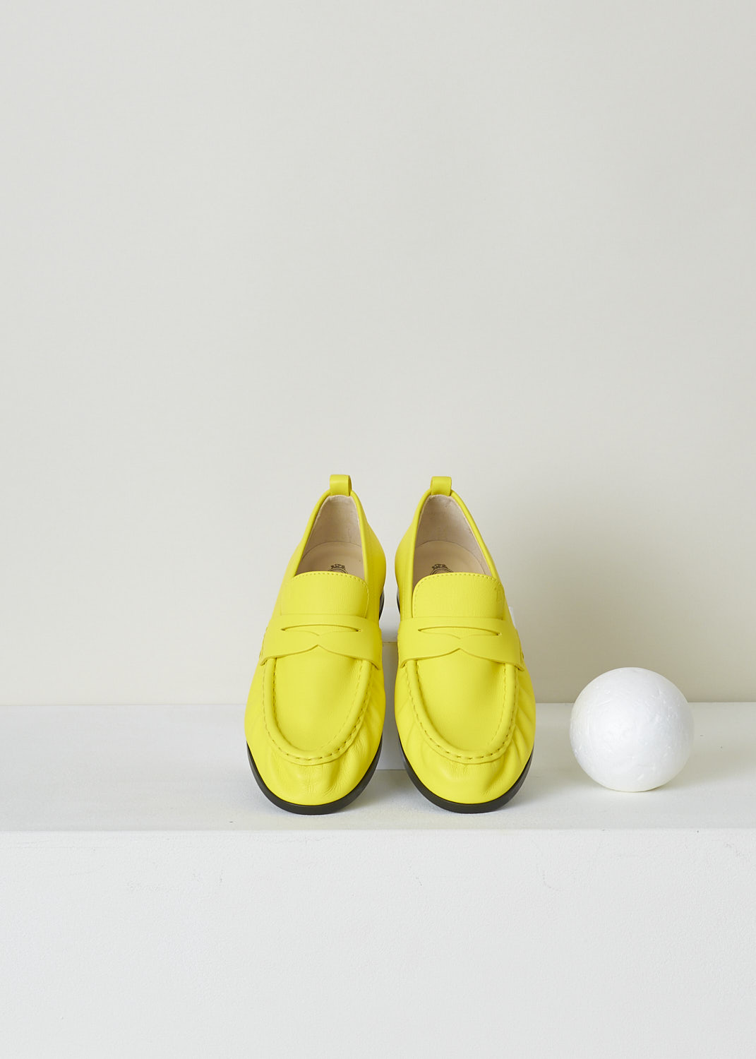 TODS, BRIGHT YELLOW PENNY LOAFERS, XXW02E0EC60PHXG009_PHX_HOLIDAY, Yellow, Top, These bright yellow slip-on penny loafers have a rounded toe and a decorative slotted leather strip over the upper side. Around the trim, the leather is subtly pleated. These loafers have black soles.
