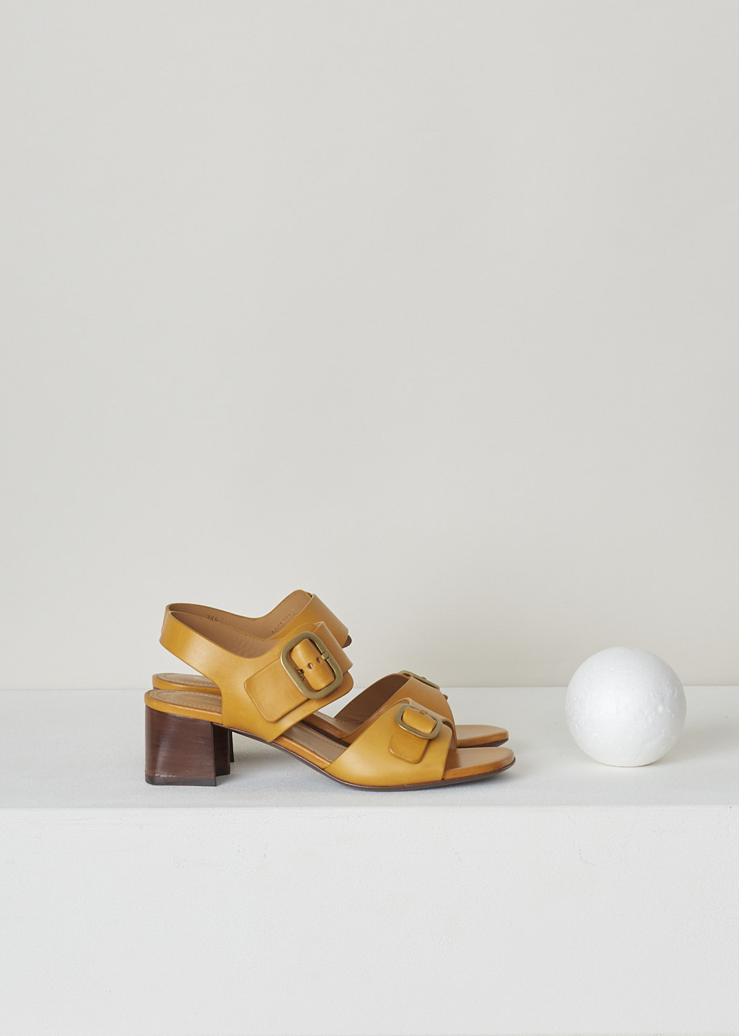 TODS, ORANGE BUCKLE SANDALS WITH HEEL, XXW04J0FH60NHVG816_SAND_CUOIO_MANDARINO, Orange, Yellow, Side, These orange heeled sandals have a double buckle-strap fastening with gold-toned buckles, a slingback strap and a squared open toe. 
