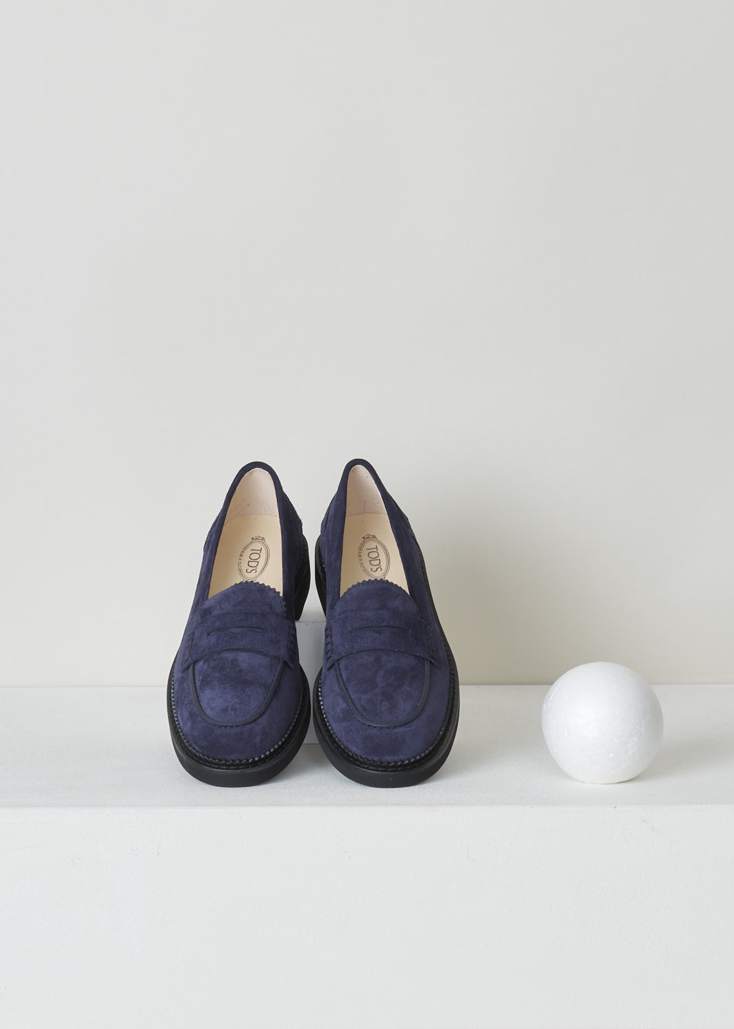 TODS, BLUE SUEDE PENNY LOAFERS, XXW76B0BP10RE0U824, Blue, Top, These blue suede slip-on penny loafers have a rounded toe and a decorative slotted leather strip over the upper side. The upper side being decorated with serrated edges. These loafers have black soles. 
