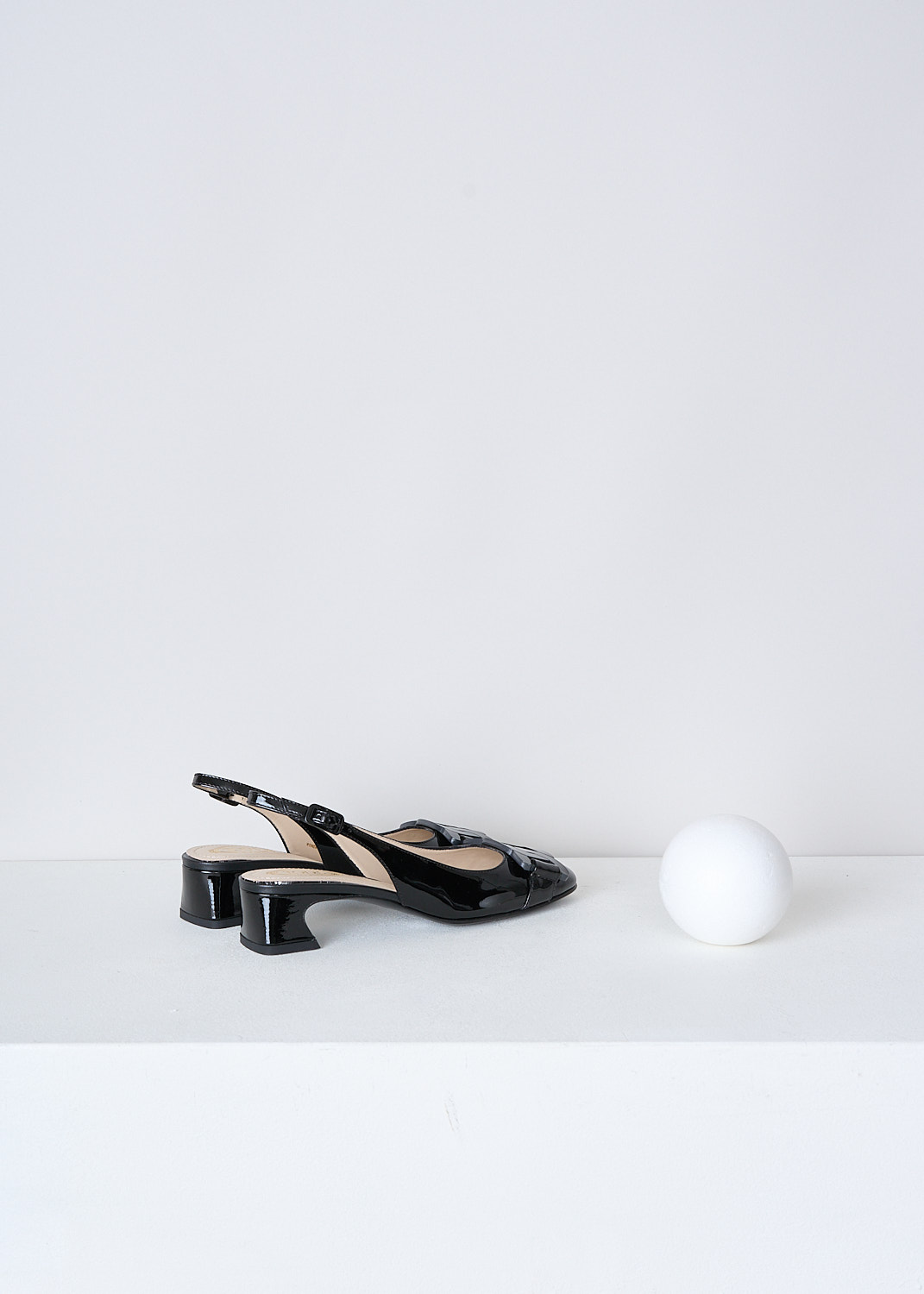 TODS, BLACK LACQUER SLINGBACKS, XXW85C0EC10SFKB999, Black, Back, These black lacquer slingbacks have an adjustable ankle strap. The  pumps have a closed round nose with an exaggerated black chain detail with the brand's logo debossed on the front.
