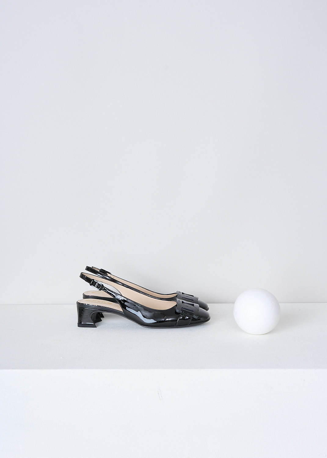 TODS, BLACK LACQUER SLINGBACKS, XXW85C0EC10SFKB999, Black, Side, These black lacquer slingbacks have an adjustable ankle strap. The  pumps have a closed round nose with an exaggerated black chain detail with the brand's logo debossed on the front.
