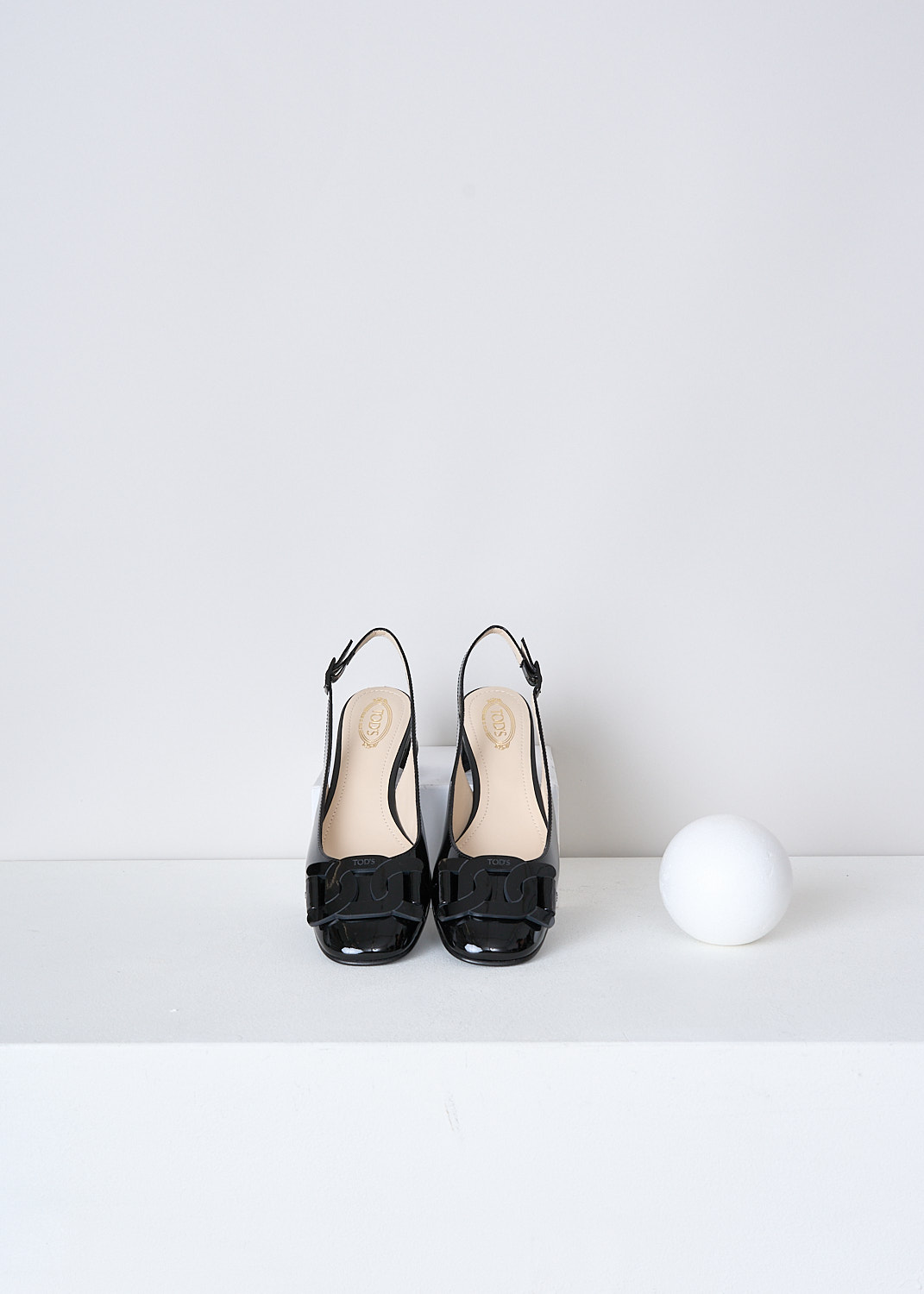 TODS, BLACK LACQUER SLINGBACKS, XXW85C0EC10SFKB999, Black, Top, These black lacquer slingbacks have an adjustable ankle strap. The  pumps have a closed round nose with an exaggerated black chain detail with the brand's logo debossed on the front.
