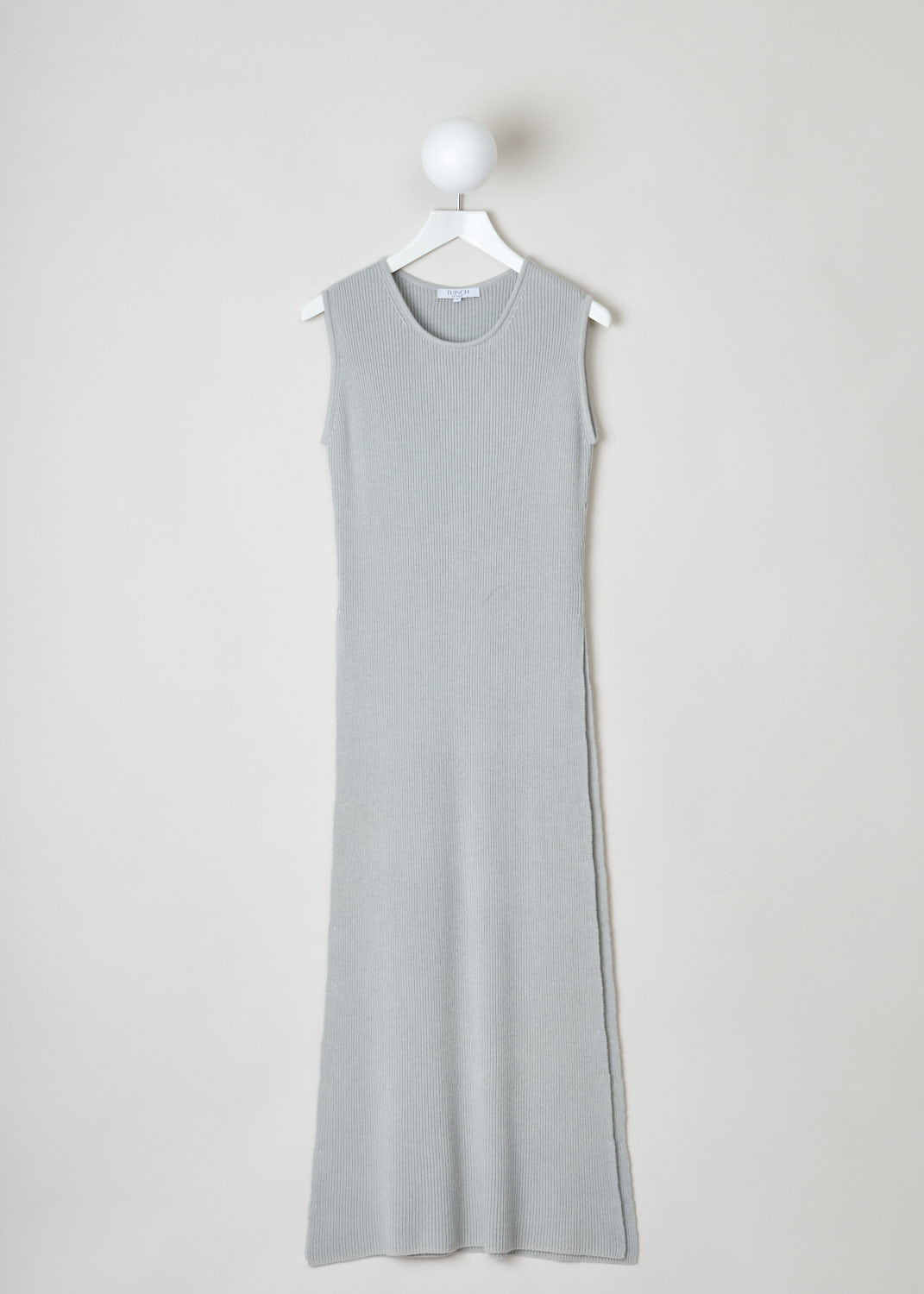 Tuinch, Knitted grey dress, Sumdress_007_grey, grey, front. Maxi-length knitted dress in light grey with a round neckline and no sleeves. This dress has a split on each side that goes up hip height.  