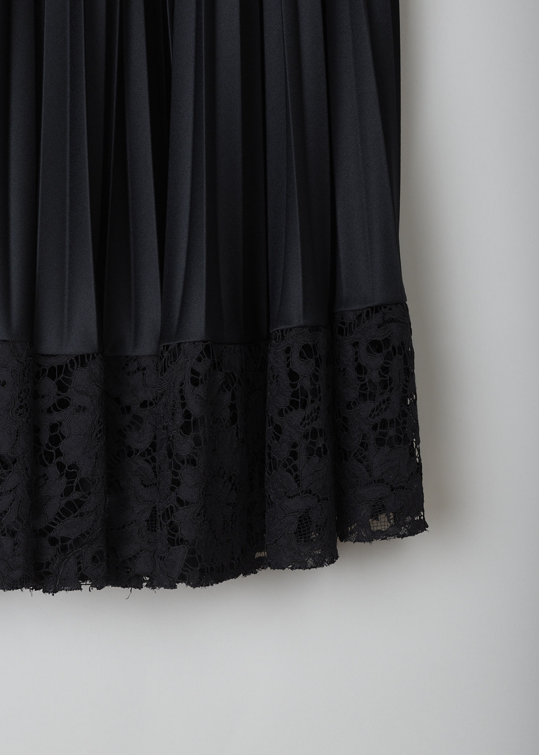 VALENTINO, BLACK PLEATED SKIRT WITH LACE TRIM, TB3MD01H575_0N0, Black, Detail, This black pleated skirt has a partly elasticated waistband with the brand's logo on it to one side. The skirt has a below-the-knee length. The straight hemline has a broad black lace trim.   
