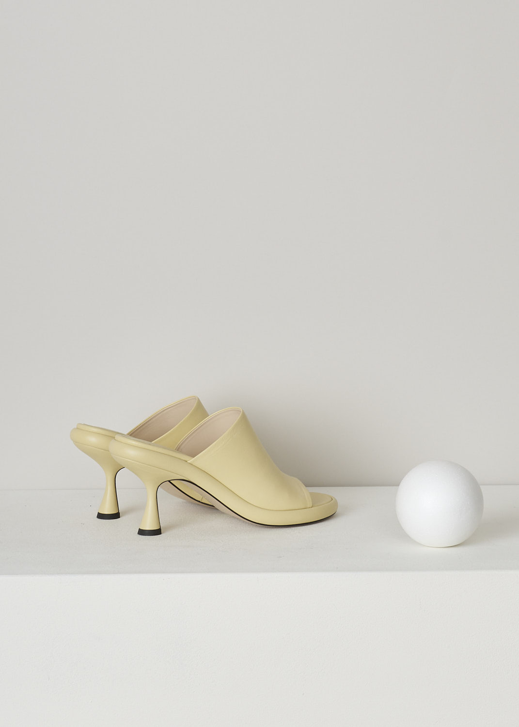 WANDLER, JUNE PLATFORM PUMP IN CANDLE, 22208_871201_1435, Yellow, Back, These pale yellow heeled slip-on mules have a broad strap across the vamp, a rounded open-toe and a platform sole. The slip-on mules have a mid-height spool heel.
