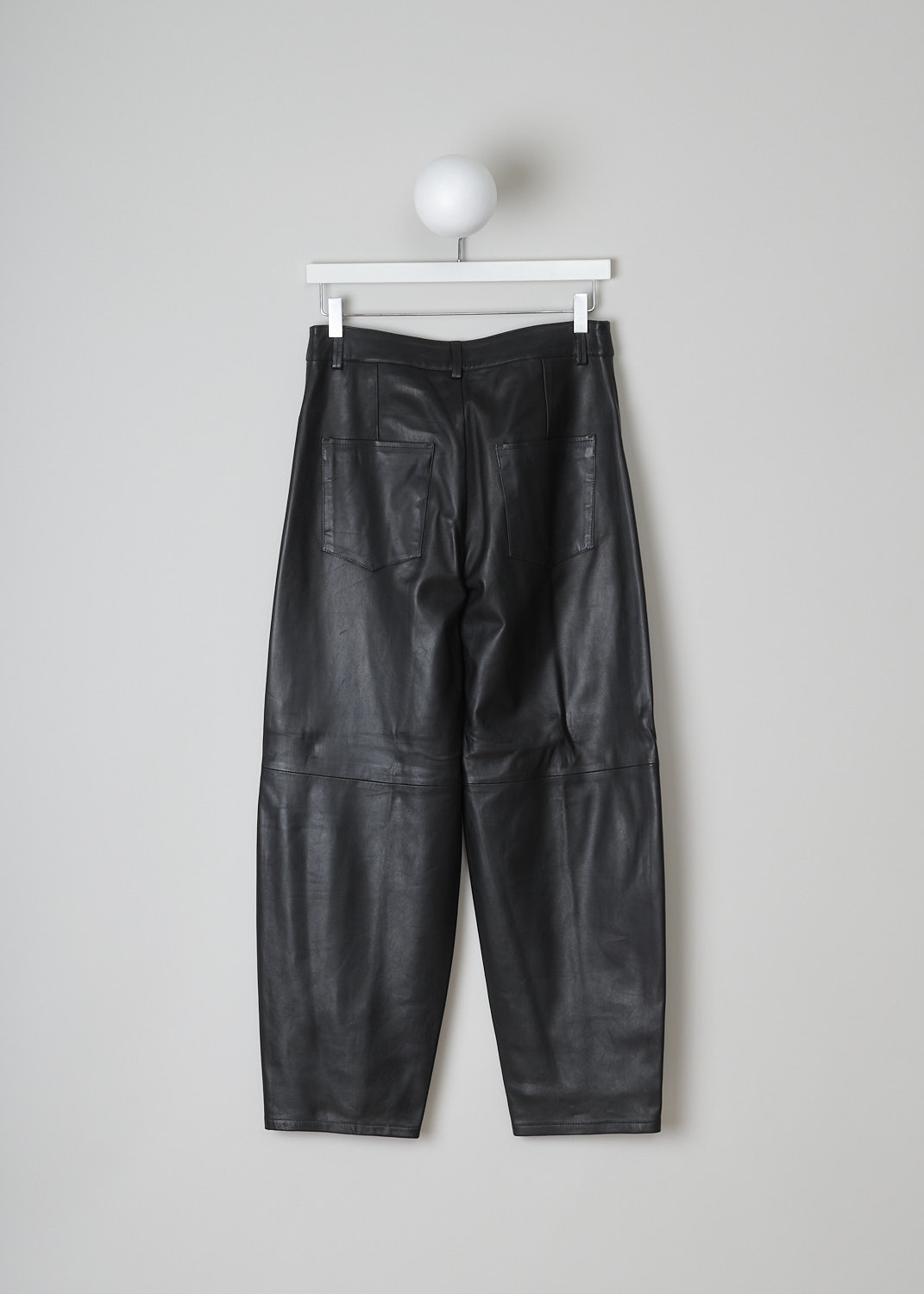 WANDLER, CHAMOMILE BLACK PANTS, 22306_060301_3200_CHAMOMILE_BLACK, Black, Back, These black leather Chamomile pants have a waistband with belt loops and a button and zip closure. The pants have a high-waisted fit. The balloon legs are cropped at the ankle. These pants have slanted pockets in the front and patch pockets in the back. 

