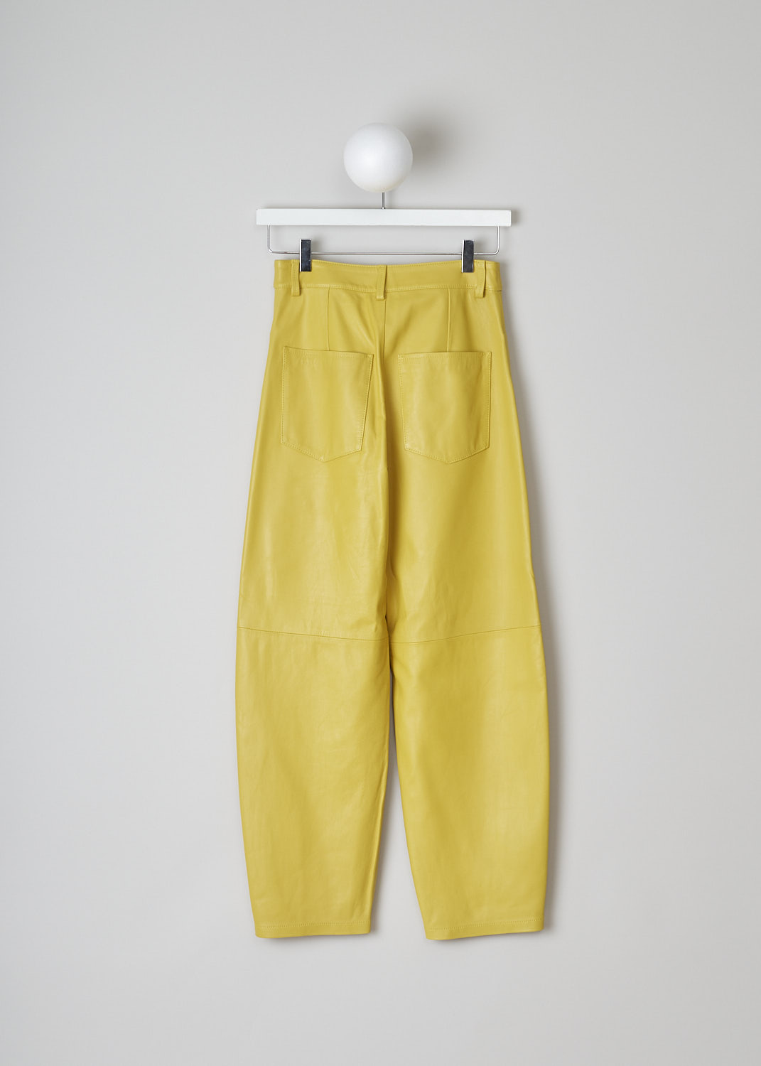 WANDLER, CHAMOMILE HOLIDAY PANTS, 22306_060301_1434_CHAMOMILE_HOLIDAY, Yellow, Back, These yellow leather Chamomile pants have a waistband with belt loops and a button and zip closure. The pants have a high-waisted fit. The balloon legs are cropped at the ankle. These pants have slanted pockets in the front and patch pockets in the back. 

