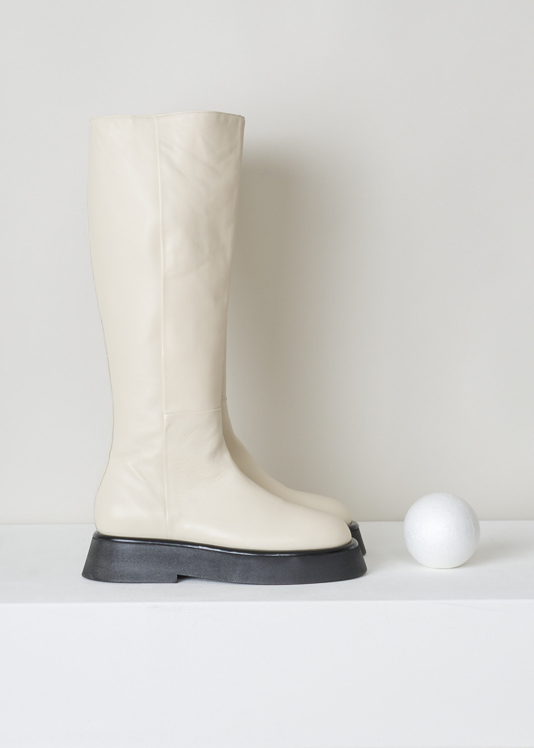 Wandler, Full-length white rosa boot, 21208_601204_1062_moon, white, side, Made out of the softest kind of leather being lambskin, featuring a full length concealed zipper. The thick flat sole flares out a bit, adding power to this minimalistic design. 